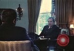Image of Nixon talking to Kissinger in Oval Office Washington DC USA, 1973, second 5 stock footage video 65675057083