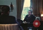 Image of Nixon talking to Kissinger in Oval Office Washington DC USA, 1973, second 6 stock footage video 65675057083