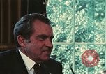 Image of Nixon talking to Kissinger in Oval Office Washington DC USA, 1973, second 20 stock footage video 65675057083