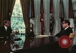 Image of Nixon talking to Kissinger in Oval Office Washington DC USA, 1973, second 28 stock footage video 65675057083