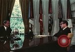 Image of Nixon talking to Kissinger in Oval Office Washington DC USA, 1973, second 30 stock footage video 65675057083