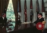 Image of Nixon talking to Kissinger in Oval Office Washington DC USA, 1973, second 31 stock footage video 65675057083