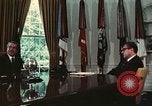 Image of Nixon talking to Kissinger in Oval Office Washington DC USA, 1973, second 32 stock footage video 65675057083
