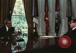 Image of Nixon talking to Kissinger in Oval Office Washington DC USA, 1973, second 40 stock footage video 65675057083