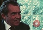 Image of Nixon talking to Kissinger in Oval Office Washington DC USA, 1973, second 42 stock footage video 65675057083