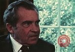 Image of Nixon talking to Kissinger in Oval Office Washington DC USA, 1973, second 44 stock footage video 65675057083