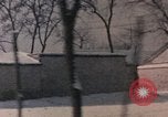 Image of Nixon motorcade in snow China, 1972, second 50 stock footage video 65675057373