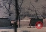 Image of Nixon motorcade in snow China, 1972, second 51 stock footage video 65675057373