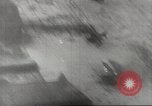 Image of aerial bombing Pacific Theater, 1945, second 55 stock footage video 65675057706