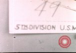 Image of US soldier assists wounded tank driver Iwo Jima Iwo Jima, 1945, second 1 stock footage video 65675057724