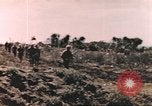 Image of US soldier assists wounded tank driver Iwo Jima Iwo Jima, 1945, second 5 stock footage video 65675057724
