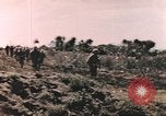 Image of US soldier assists wounded tank driver Iwo Jima Iwo Jima, 1945, second 6 stock footage video 65675057724