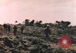 Image of US soldier assists wounded tank driver Iwo Jima Iwo Jima, 1945, second 12 stock footage video 65675057724