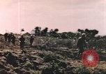 Image of US soldier assists wounded tank driver Iwo Jima Iwo Jima, 1945, second 13 stock footage video 65675057724