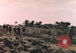 Image of US soldier assists wounded tank driver Iwo Jima Iwo Jima, 1945, second 14 stock footage video 65675057724