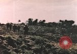 Image of US soldier assists wounded tank driver Iwo Jima Iwo Jima, 1945, second 15 stock footage video 65675057724