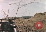 Image of US soldier assists wounded tank driver Iwo Jima Iwo Jima, 1945, second 16 stock footage video 65675057724