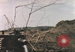 Image of US soldier assists wounded tank driver Iwo Jima Iwo Jima, 1945, second 17 stock footage video 65675057724