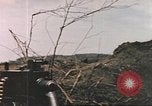 Image of US soldier assists wounded tank driver Iwo Jima Iwo Jima, 1945, second 18 stock footage video 65675057724