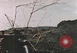 Image of US soldier assists wounded tank driver Iwo Jima Iwo Jima, 1945, second 19 stock footage video 65675057724