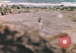 Image of US soldier assists wounded tank driver Iwo Jima Iwo Jima, 1945, second 22 stock footage video 65675057724