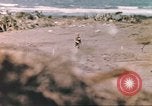 Image of US soldier assists wounded tank driver Iwo Jima Iwo Jima, 1945, second 23 stock footage video 65675057724