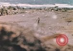 Image of US soldier assists wounded tank driver Iwo Jima Iwo Jima, 1945, second 25 stock footage video 65675057724