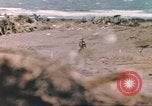 Image of US soldier assists wounded tank driver Iwo Jima Iwo Jima, 1945, second 26 stock footage video 65675057724