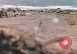 Image of US soldier assists wounded tank driver Iwo Jima Iwo Jima, 1945, second 27 stock footage video 65675057724