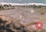 Image of US soldier assists wounded tank driver Iwo Jima Iwo Jima, 1945, second 28 stock footage video 65675057724