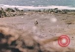 Image of US soldier assists wounded tank driver Iwo Jima Iwo Jima, 1945, second 29 stock footage video 65675057724