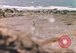 Image of US soldier assists wounded tank driver Iwo Jima Iwo Jima, 1945, second 30 stock footage video 65675057724