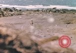 Image of US soldier assists wounded tank driver Iwo Jima Iwo Jima, 1945, second 31 stock footage video 65675057724