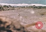 Image of US soldier assists wounded tank driver Iwo Jima Iwo Jima, 1945, second 32 stock footage video 65675057724