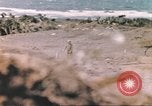 Image of US soldier assists wounded tank driver Iwo Jima Iwo Jima, 1945, second 33 stock footage video 65675057724