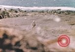 Image of US soldier assists wounded tank driver Iwo Jima Iwo Jima, 1945, second 35 stock footage video 65675057724