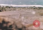 Image of US soldier assists wounded tank driver Iwo Jima Iwo Jima, 1945, second 37 stock footage video 65675057724