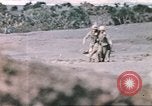 Image of US soldier assists wounded tank driver Iwo Jima Iwo Jima, 1945, second 38 stock footage video 65675057724