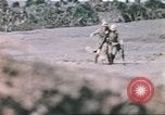 Image of US soldier assists wounded tank driver Iwo Jima Iwo Jima, 1945, second 39 stock footage video 65675057724