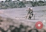 Image of US soldier assists wounded tank driver Iwo Jima Iwo Jima, 1945, second 40 stock footage video 65675057724