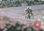 Image of US soldier assists wounded tank driver Iwo Jima Iwo Jima, 1945, second 41 stock footage video 65675057724