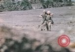 Image of US soldier assists wounded tank driver Iwo Jima Iwo Jima, 1945, second 42 stock footage video 65675057724