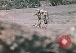 Image of US soldier assists wounded tank driver Iwo Jima Iwo Jima, 1945, second 44 stock footage video 65675057724