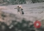 Image of US soldier assists wounded tank driver Iwo Jima Iwo Jima, 1945, second 45 stock footage video 65675057724