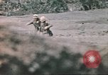 Image of US soldier assists wounded tank driver Iwo Jima Iwo Jima, 1945, second 46 stock footage video 65675057724