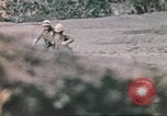 Image of US soldier assists wounded tank driver Iwo Jima Iwo Jima, 1945, second 47 stock footage video 65675057724