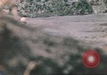 Image of US soldier assists wounded tank driver Iwo Jima Iwo Jima, 1945, second 51 stock footage video 65675057724