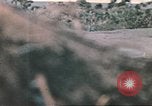 Image of US soldier assists wounded tank driver Iwo Jima Iwo Jima, 1945, second 53 stock footage video 65675057724