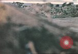 Image of US soldier assists wounded tank driver Iwo Jima Iwo Jima, 1945, second 54 stock footage video 65675057724