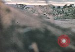 Image of US soldier assists wounded tank driver Iwo Jima Iwo Jima, 1945, second 55 stock footage video 65675057724